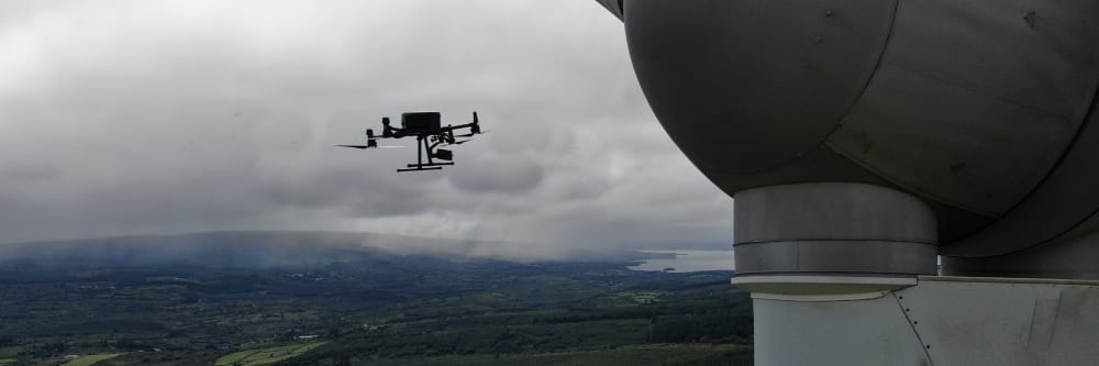 A drone inspecting a wind turbine in ireland